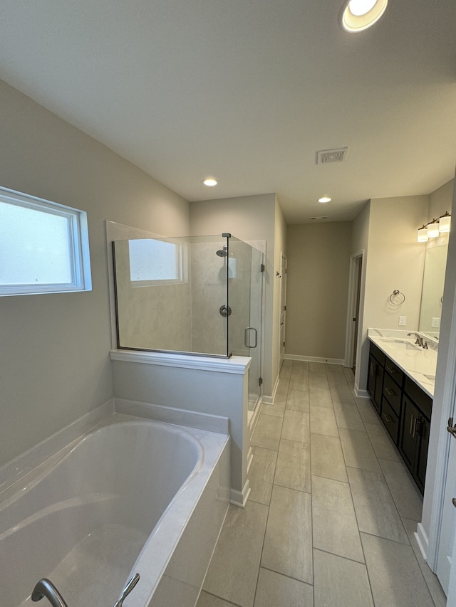 bathroom with vanity, tile patterned floors, and separate shower and tub