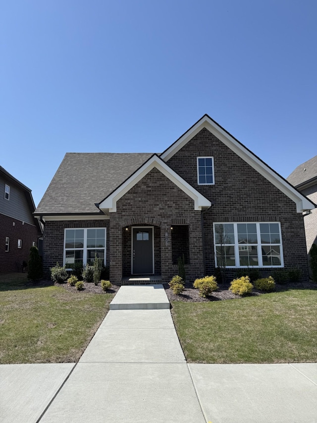 6109 Parkhaven Blvd, Hermitage, TN 37076 - view of front of property featuring brick siding, a front yard, and roof with shingles