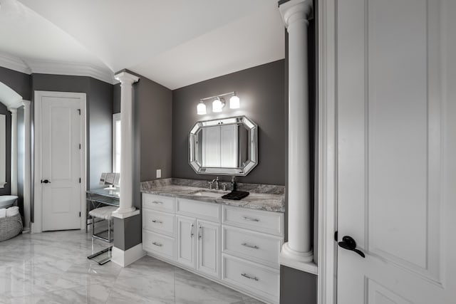 bathroom featuring oversized vanity, decorative columns, ornamental molding, and tile flooring