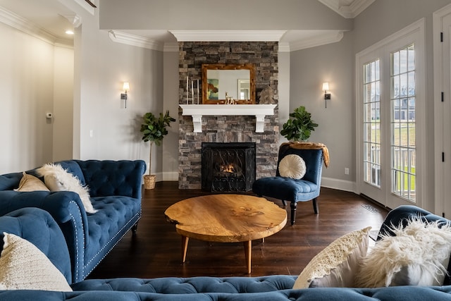 living room featuring a wealth of natural light, ornamental molding, dark hardwood / wood-style floors, and a fireplace