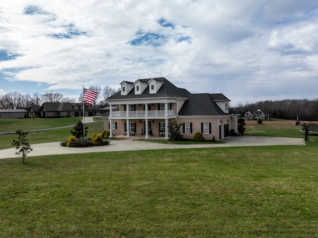 rear view of property with a yard