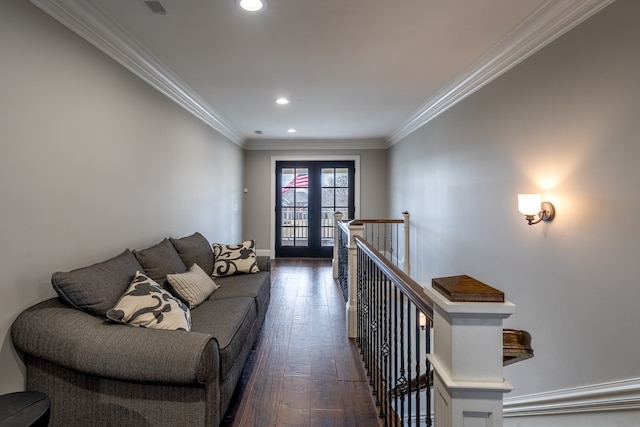 living room with crown molding, french doors, and dark hardwood / wood-style flooring