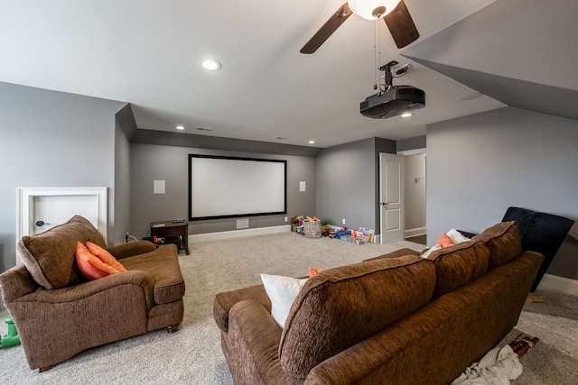 carpeted cinema featuring ceiling fan