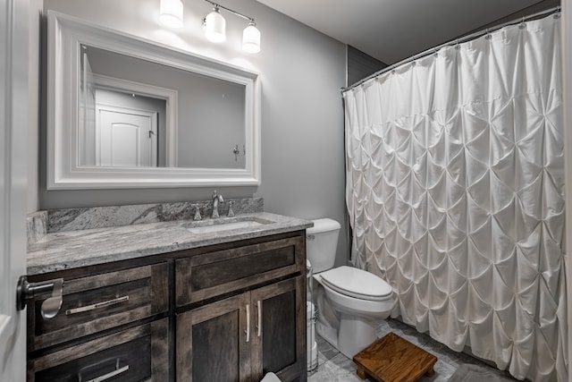 bathroom featuring tile floors, toilet, and vanity