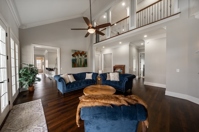 living room featuring dark hardwood / wood-style floors, ceiling fan, high vaulted ceiling, french doors, and ornamental molding