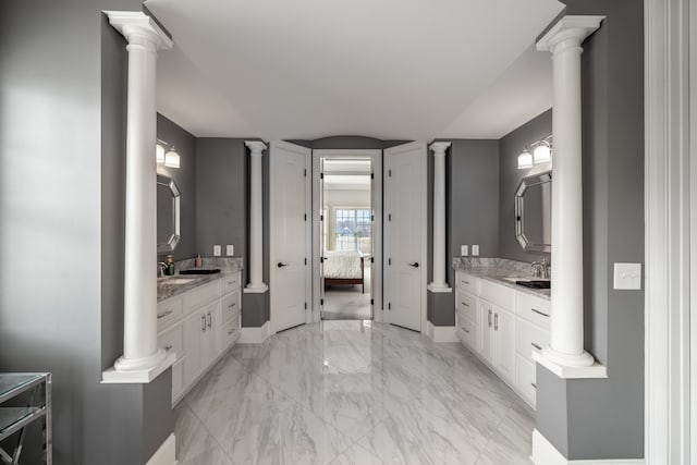 bathroom with vanity, tile floors, and decorative columns