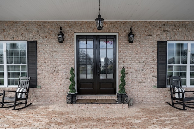 view of exterior entry featuring french doors