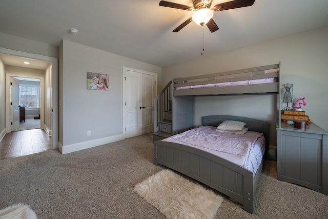 bedroom featuring dark carpet and ceiling fan