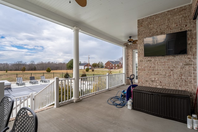 view of terrace featuring ceiling fan