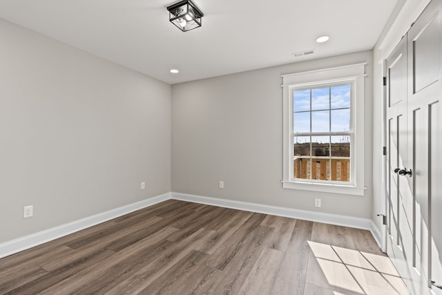 spare room featuring light wood-type flooring