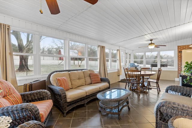 sunroom / solarium featuring wooden ceiling and ceiling fan