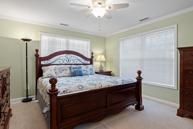 carpeted bedroom featuring ornamental molding and ceiling fan