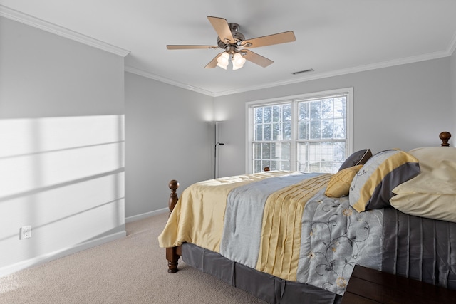 carpeted bedroom featuring ceiling fan and ornamental molding