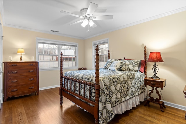 bedroom featuring ceiling fan, dark hardwood / wood-style floors, and crown molding