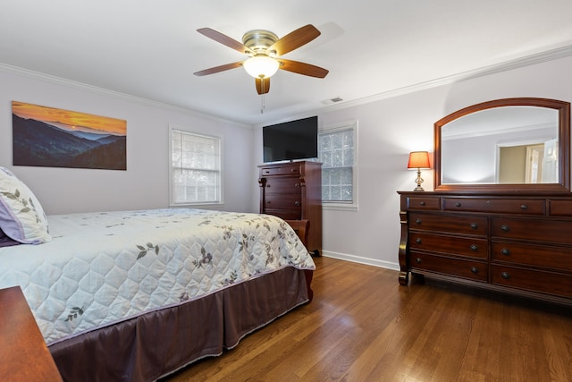 bedroom featuring ornamental molding, ceiling fan, and dark wood-type flooring