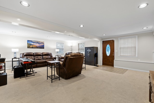 living room featuring crown molding and light carpet