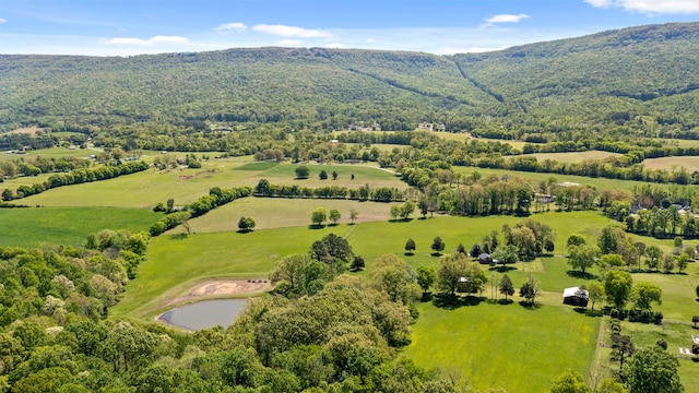 drone / aerial view featuring a water and mountain view