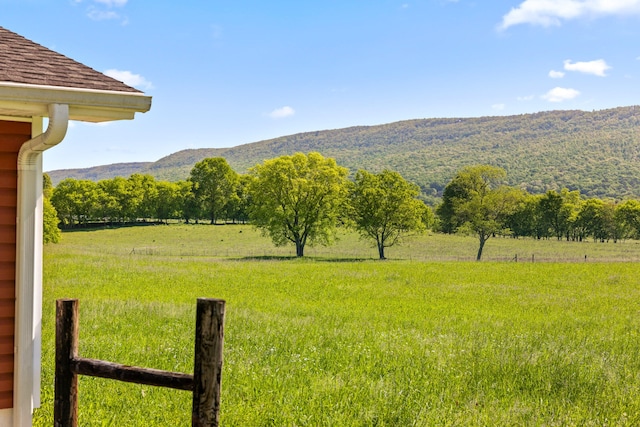 view of yard featuring a mountain view and a rural view