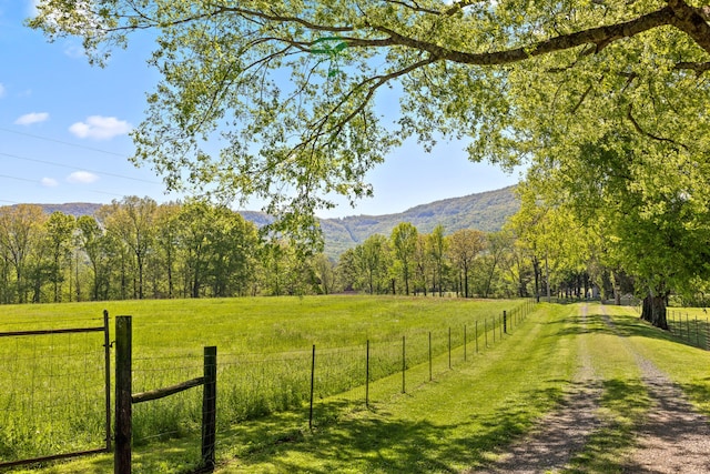 exterior space with a rural view and a mountain view