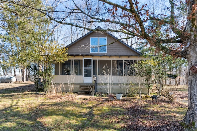 view of front of home featuring a sunroom