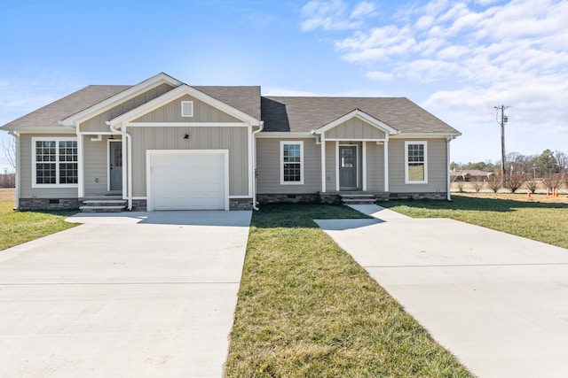 view of front of house with a front lawn and a garage