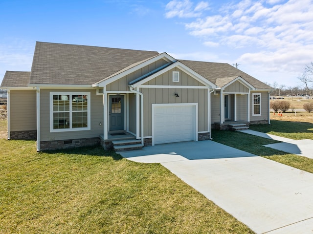 view of front of property featuring a front yard and a garage