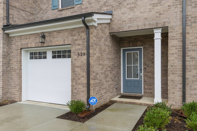 property entrance with a garage