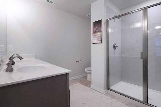 bathroom with toilet, double sink vanity, tile flooring, and an enclosed shower