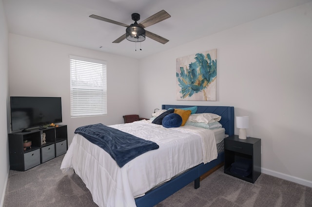 bedroom with dark carpet and ceiling fan