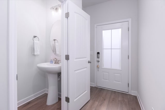 entryway with dark hardwood / wood-style floors