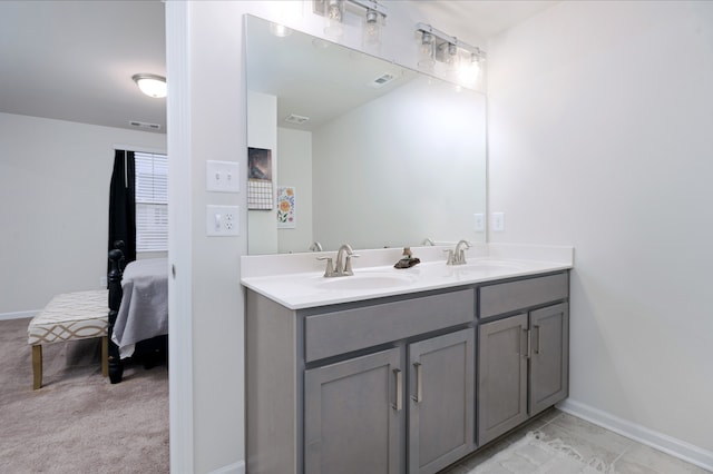 bathroom featuring double vanity and tile flooring