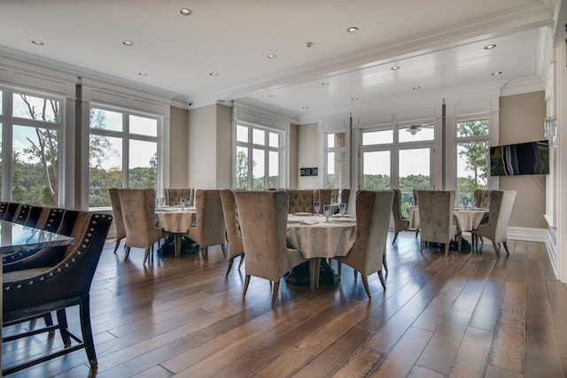 dining room with crown molding and dark hardwood / wood-style floors