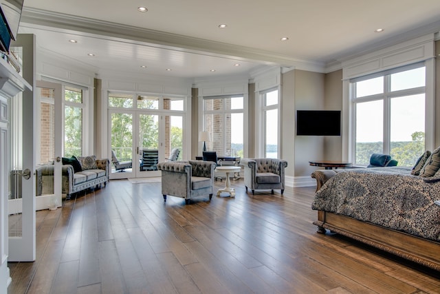 bedroom featuring french doors, ornamental molding, access to exterior, and wood-type flooring