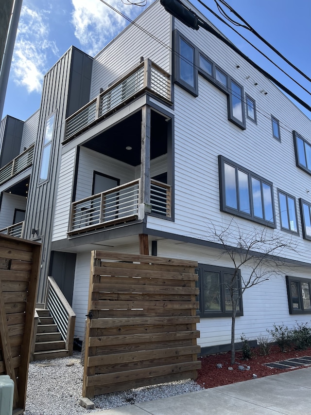 view of home's exterior with a balcony