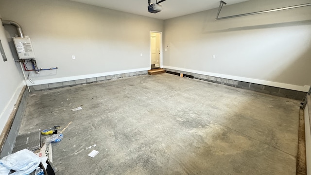 garage featuring a garage door opener and water heater