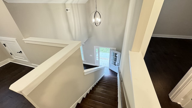 staircase featuring dark hardwood / wood-style flooring