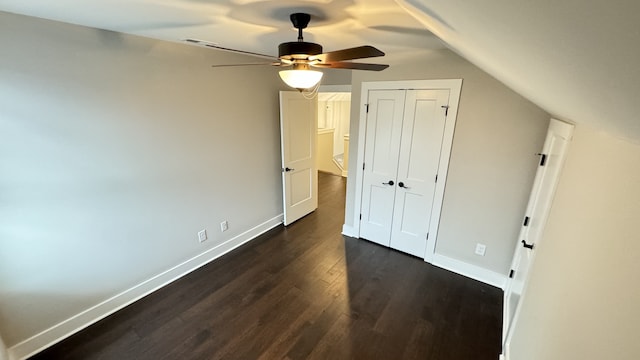 additional living space featuring ceiling fan, dark hardwood / wood-style floors, and vaulted ceiling