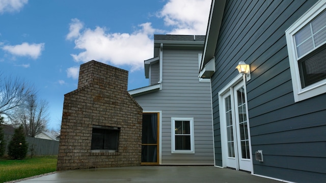 view of property exterior featuring a patio area