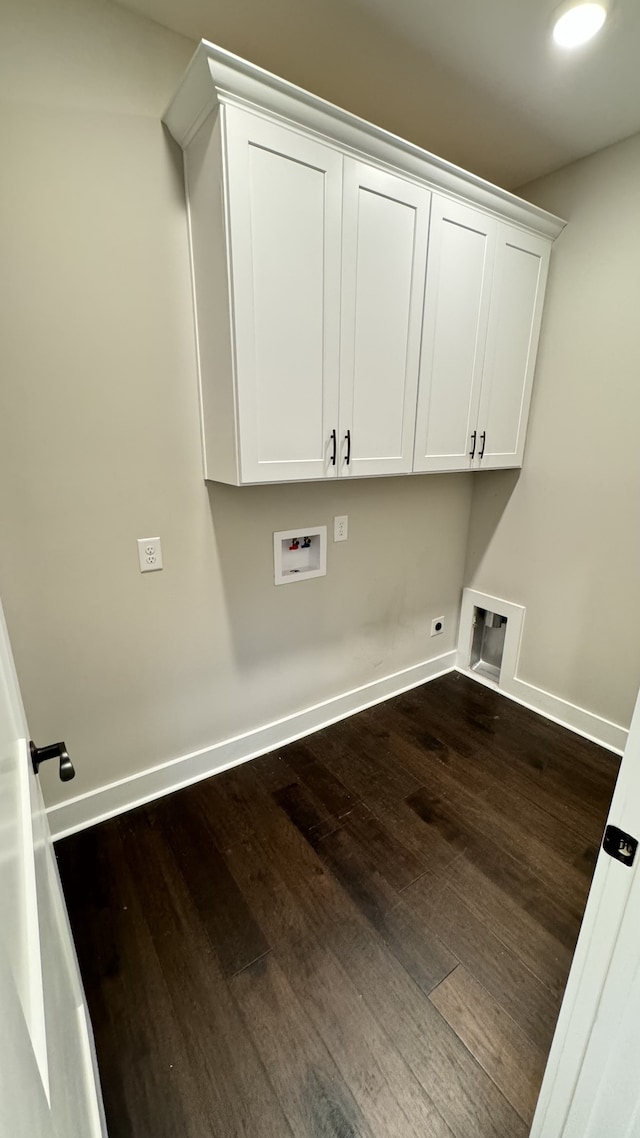 laundry area featuring hookup for a washing machine, hookup for an electric dryer, dark wood-type flooring, and cabinets