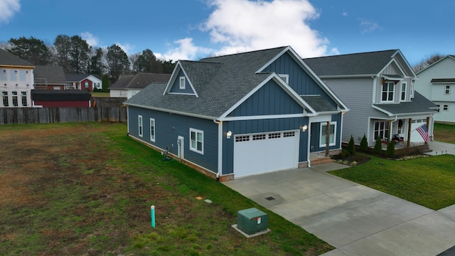 view of front of home featuring a front lawn and a garage