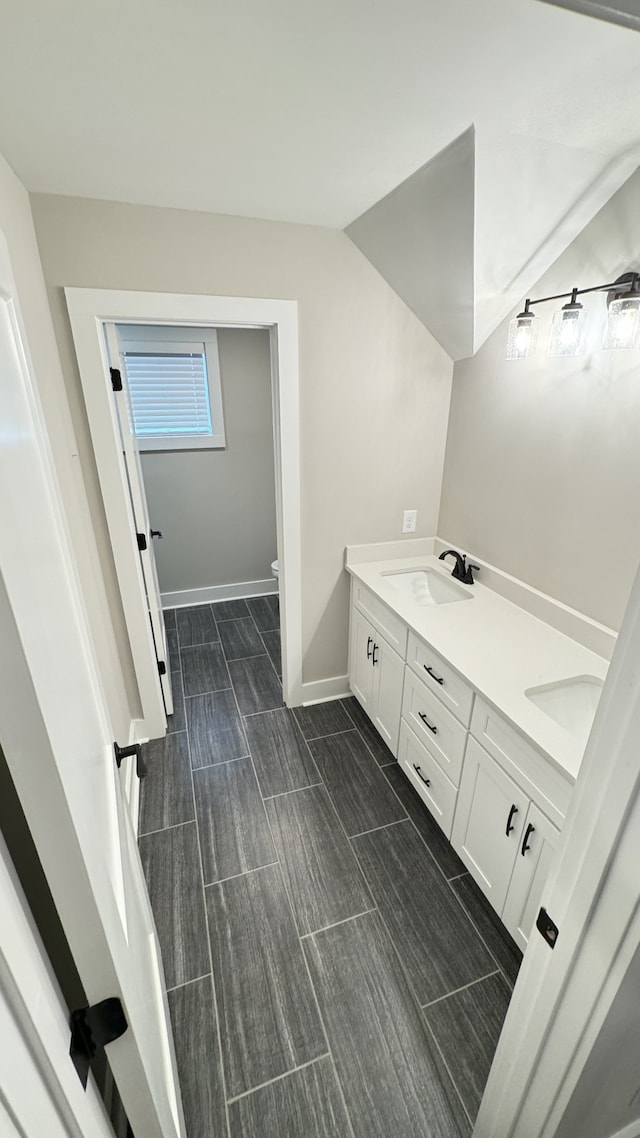 bathroom featuring dual vanity