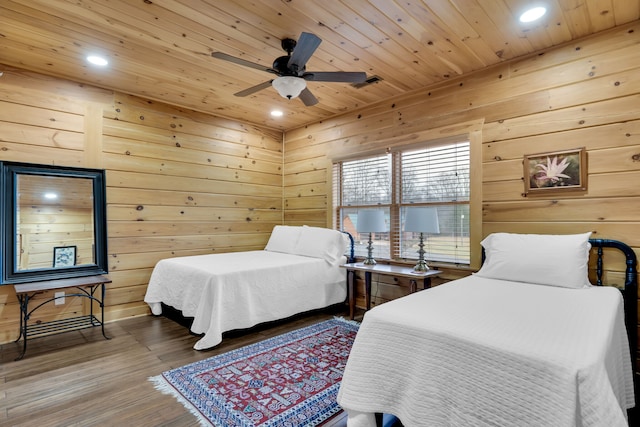 bedroom featuring ceiling fan, wood ceiling, and hardwood / wood-style floors