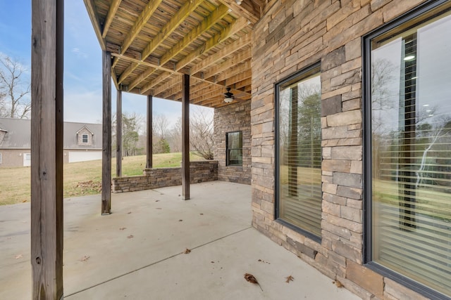 view of patio featuring ceiling fan