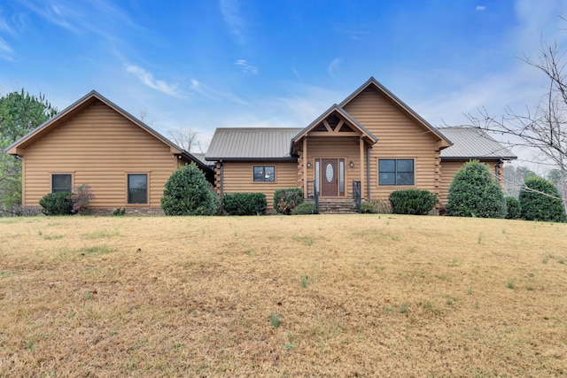 log home with a front lawn