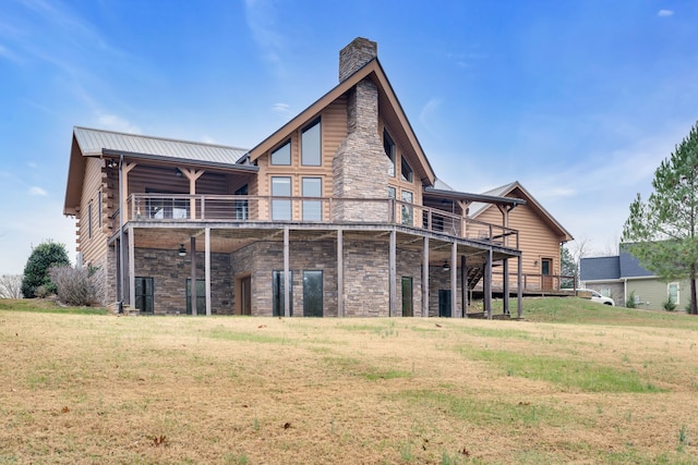 back of house with a yard and a wooden deck