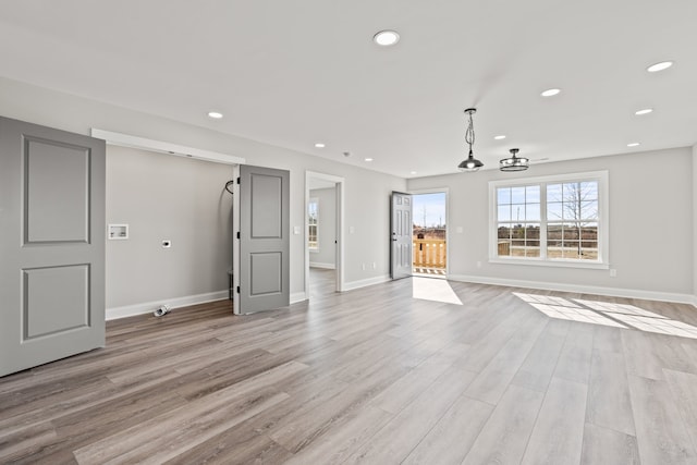 unfurnished living room featuring light wood-type flooring