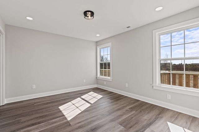 unfurnished room featuring dark hardwood / wood-style floors