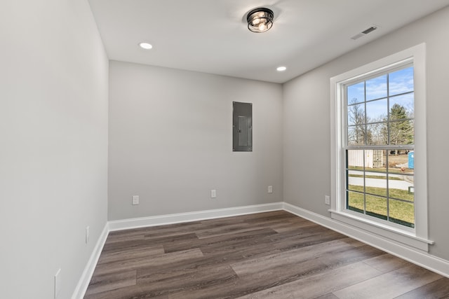 unfurnished room with dark hardwood / wood-style flooring