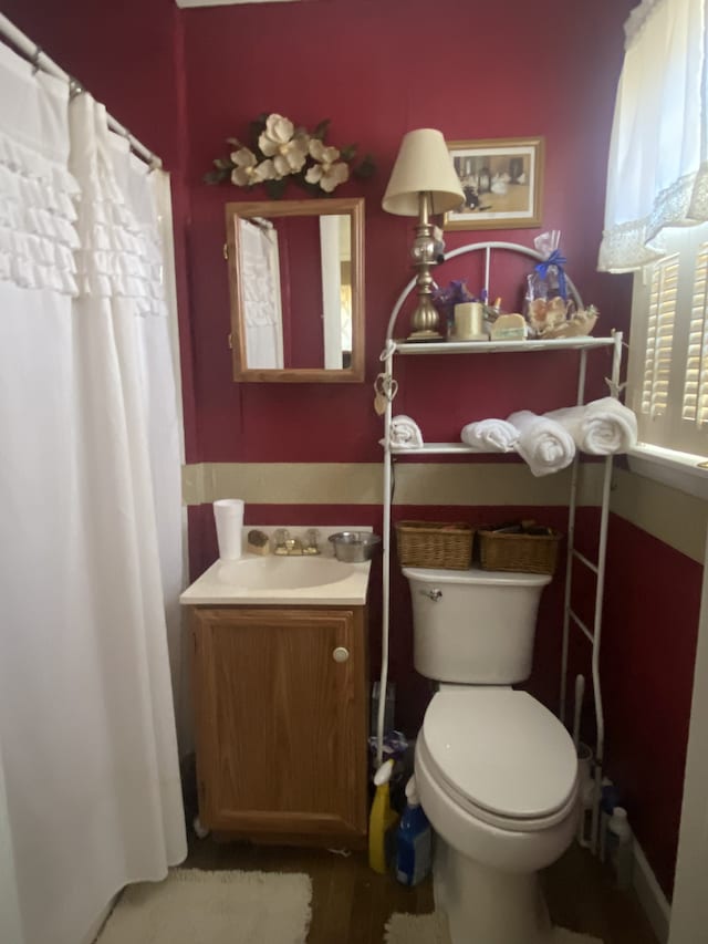 bathroom with vanity and toilet