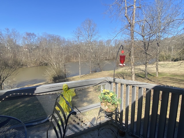 wooden deck featuring a water view